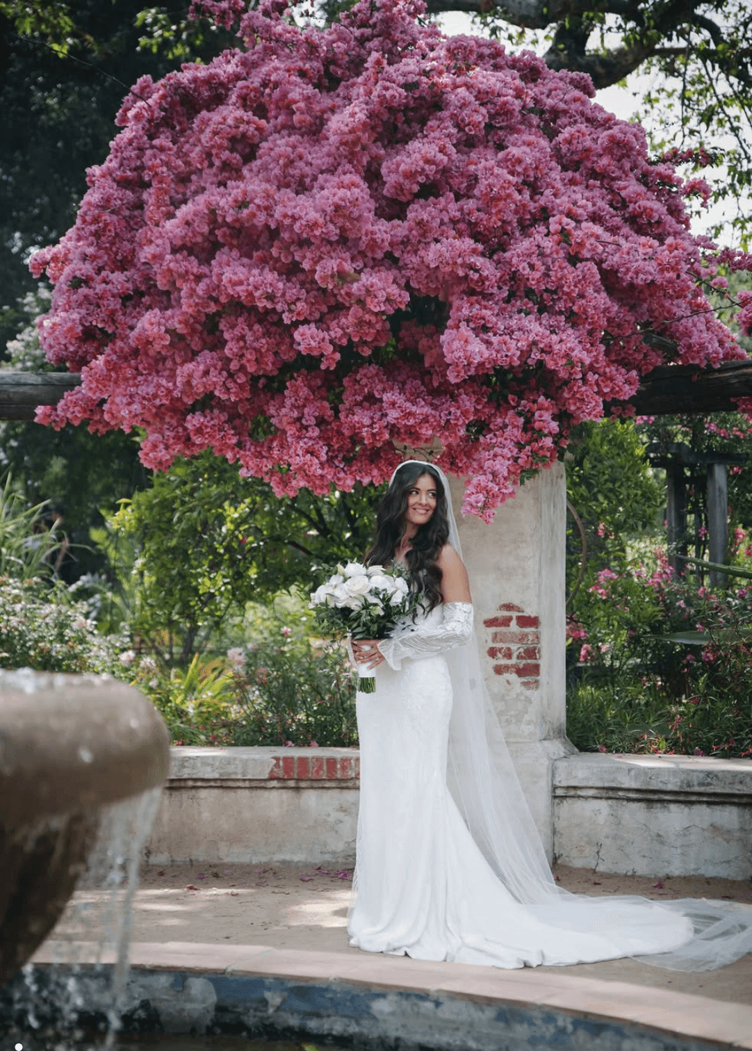 Bride beneath bougainvillea