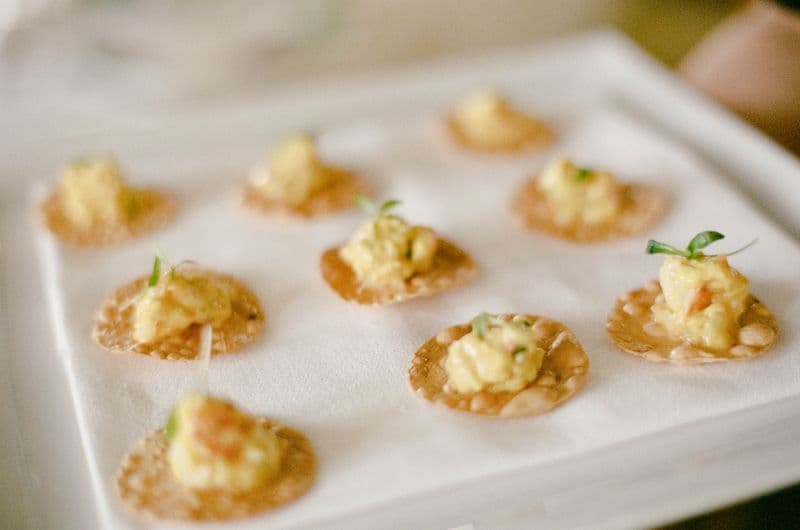 Canapés arranged on a tray during event service